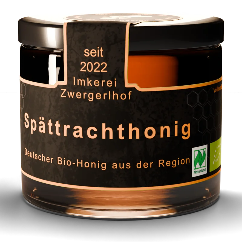Glas Spättrachthonig, flüssig und dunkel bernsteinfarben